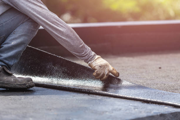 Professional Basement Waterproofing technician working in Bushwood, MD
